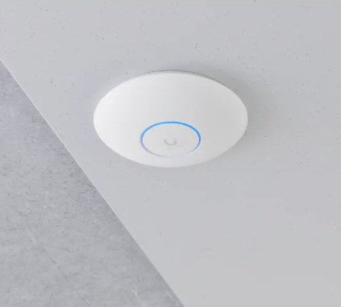 UniFi access point mounted on a finished ceiling